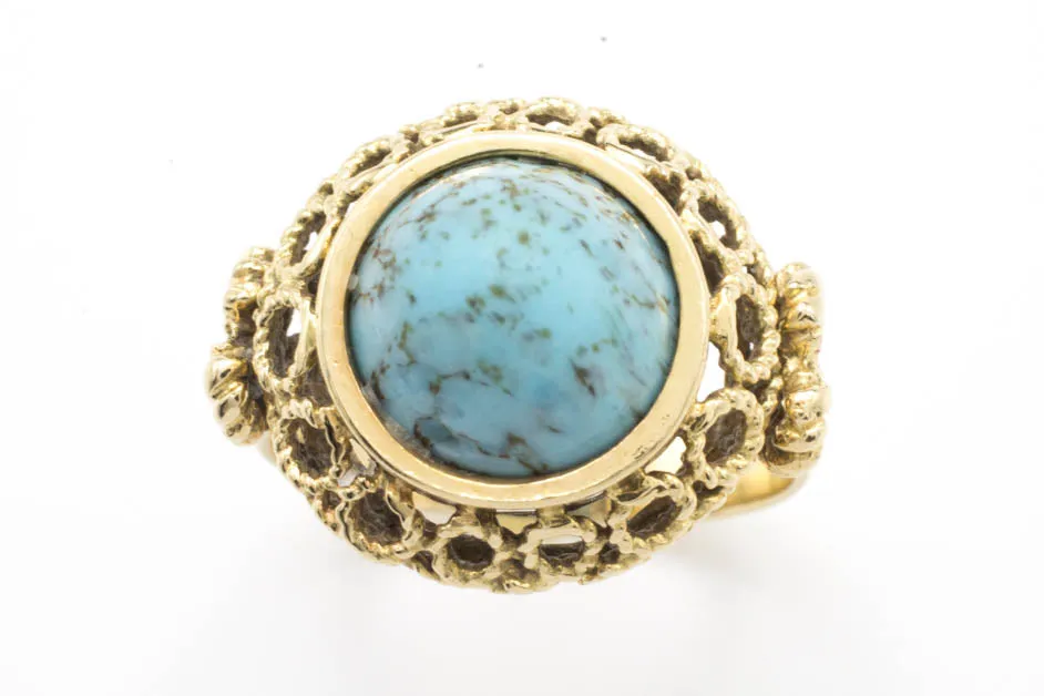 Cabochon turquoise ring in 14 carat yellow gold