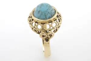 Cabochon turquoise ring in 14 carat yellow gold